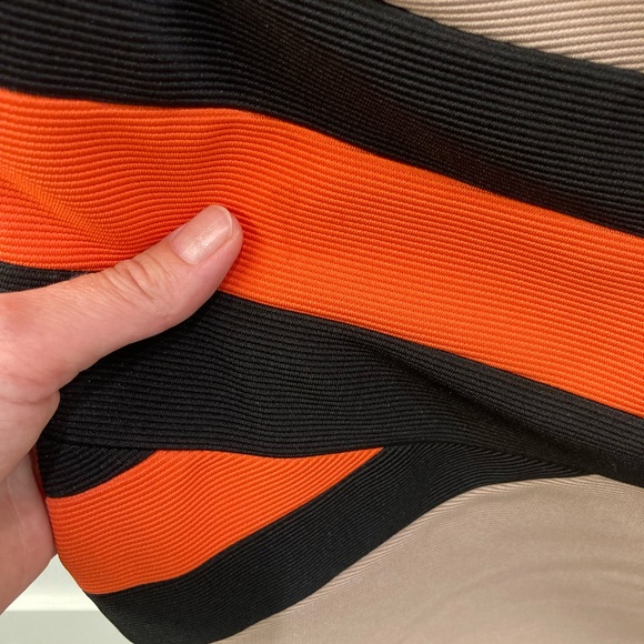 Tan bandage dress with bright orange and black waist detailing. - Picture 6 of 7